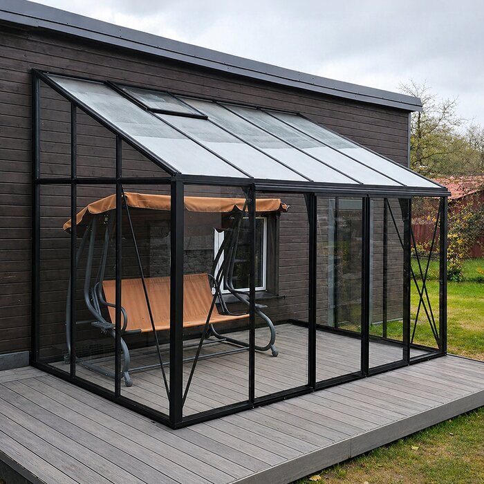 Aluminium Lean-To Greenhouse with glass glazing in a UK garden