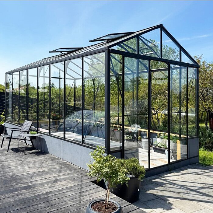 Glass greenhouse on brick stone or concrete base USA