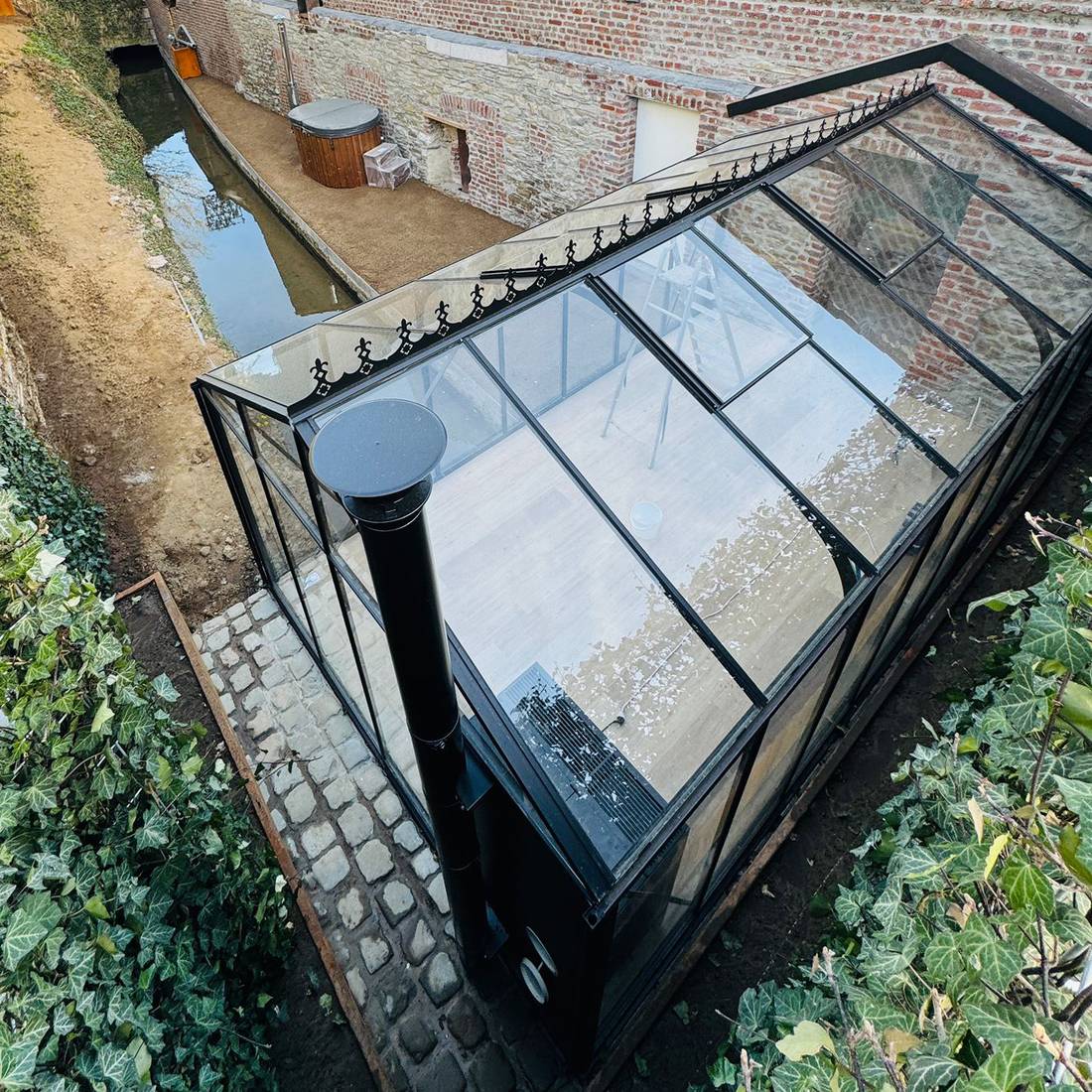 Installed Classic Premium greenhouse in a garden setting