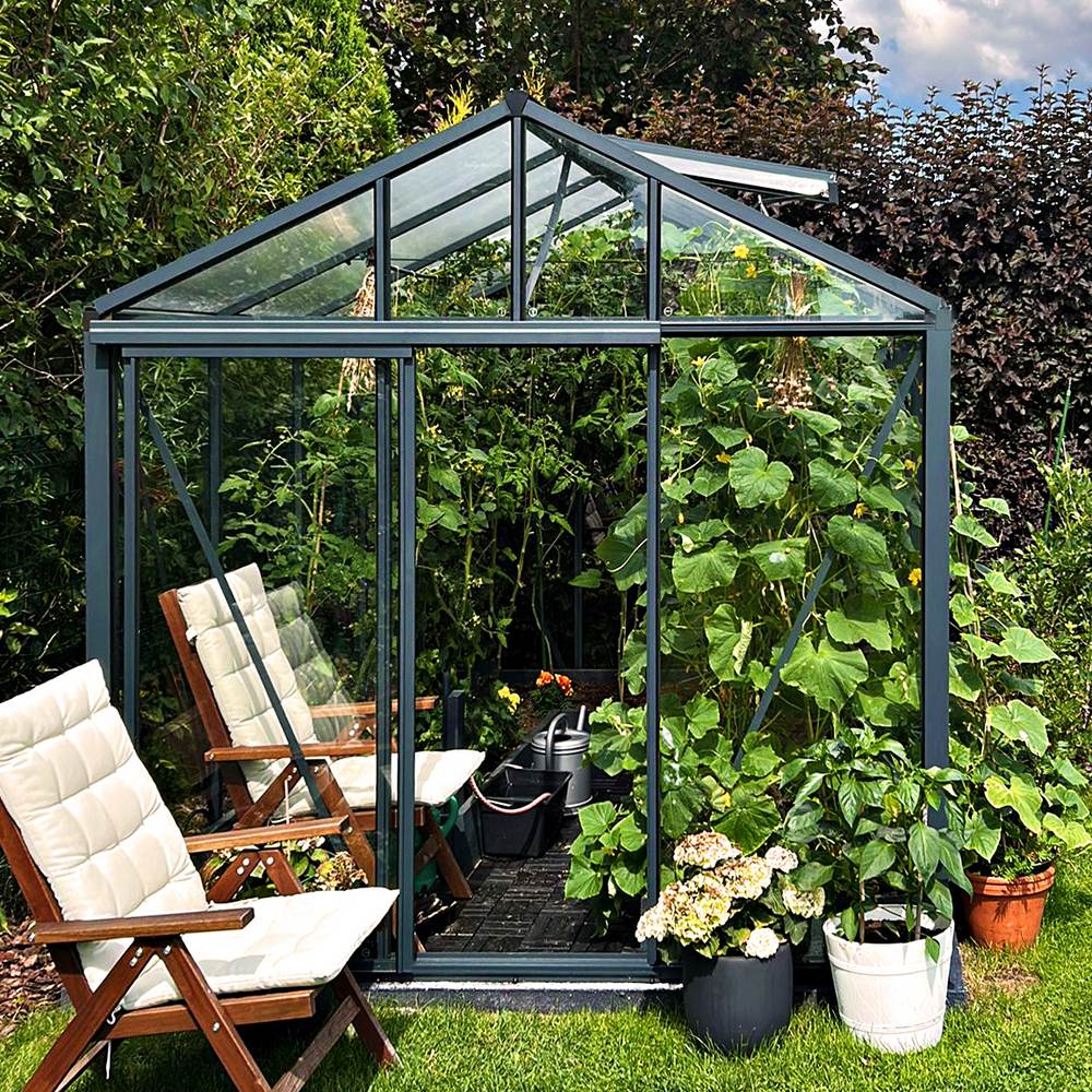 Premium Classic Bloomcabin greenhouse in an outdoor setting