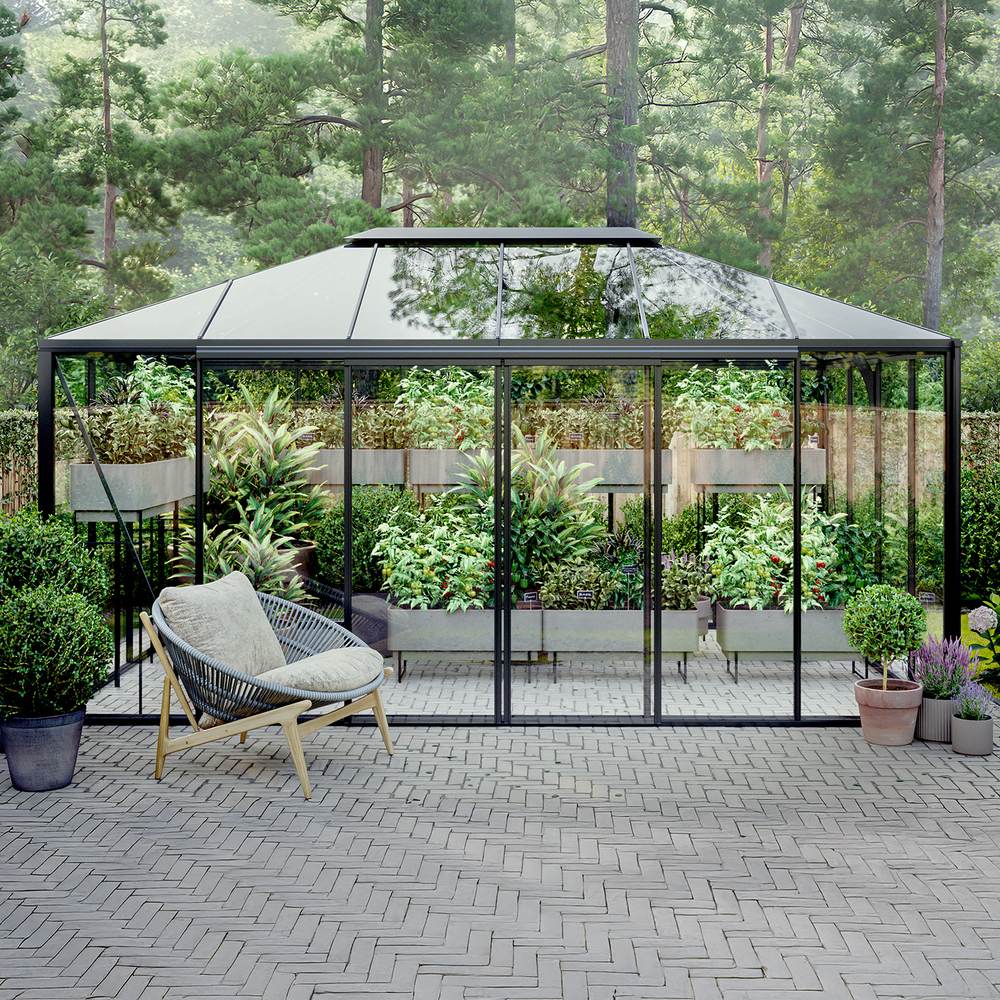 Bloomcabin pyramid-style greenhouse in an outdoor setting